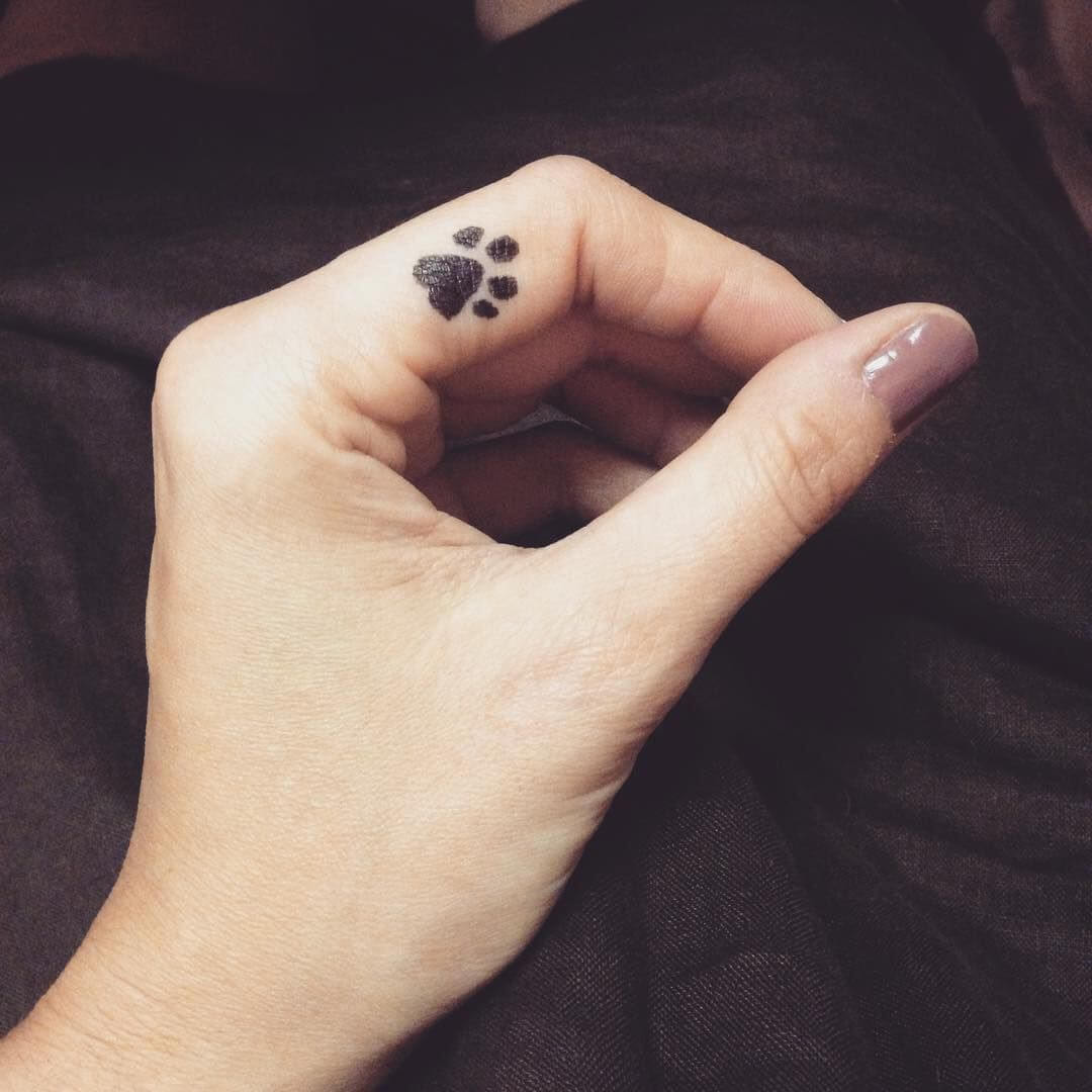 Tiny Finger Tattoo: Paw Print Tattoo